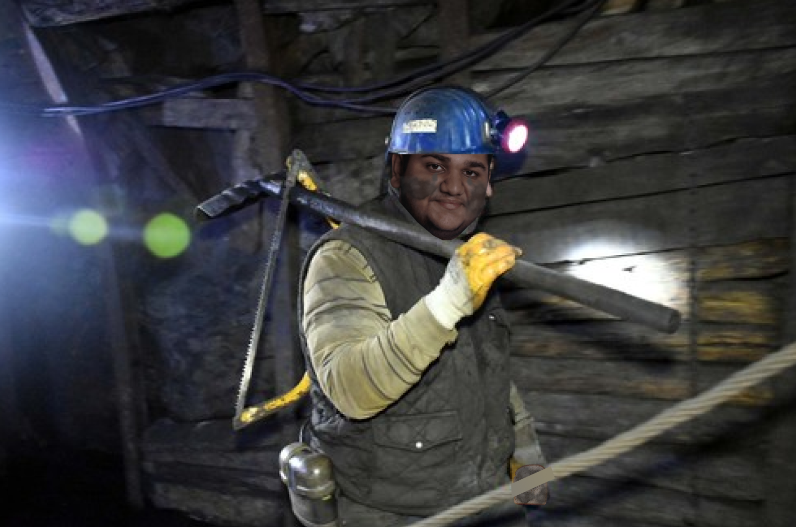 A meme photo of Kartik as a miner